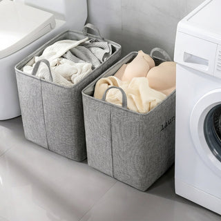 Foldable laundry basket with reinforced handles